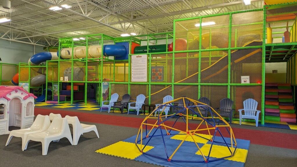 DinoDash play structure with climbing areas and open seating nearby