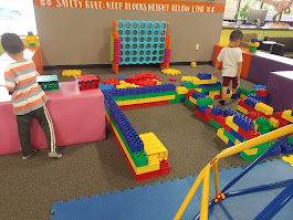Children building with large colorful blocks at DinoDash