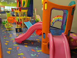 Toddler play zone with small slides and bright play panels